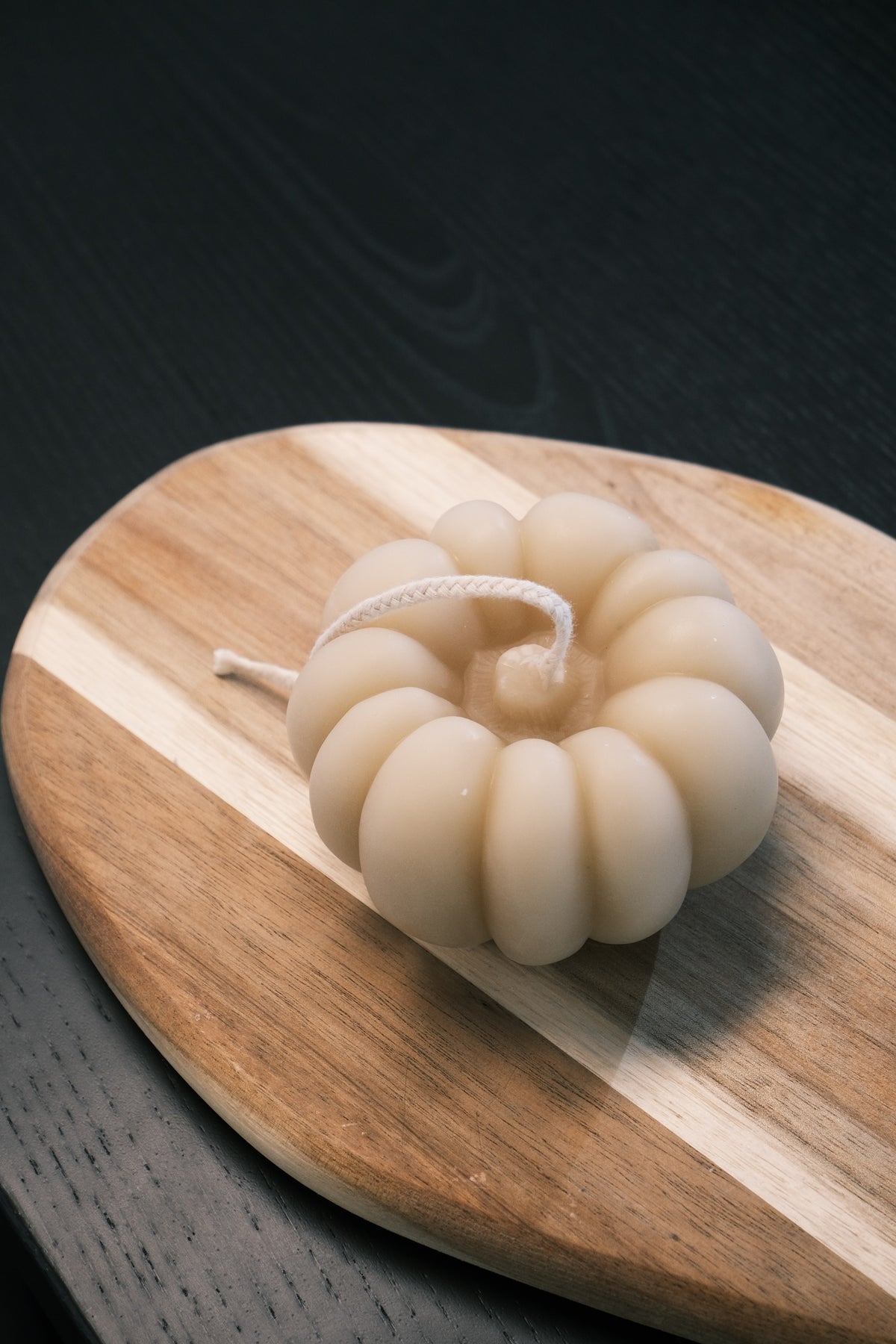 White pumpkin-shaped candle