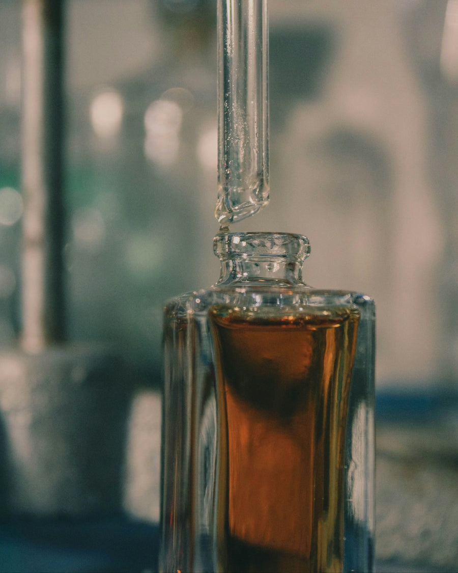 Glass bottle with a clear dropper